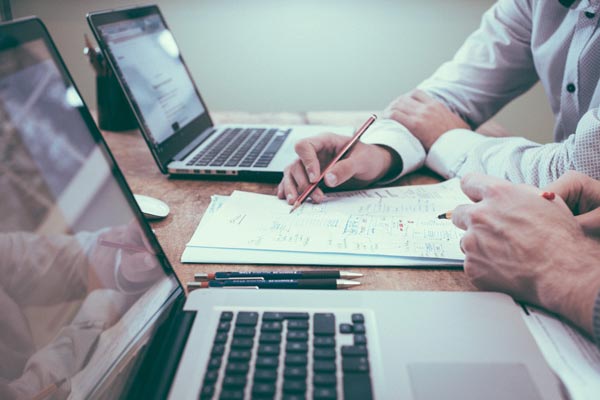 Berkeley Financial advisors reviewing accounts with a client